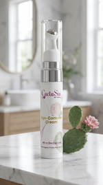 Cactus skincare product on a marble surface with a blurred background